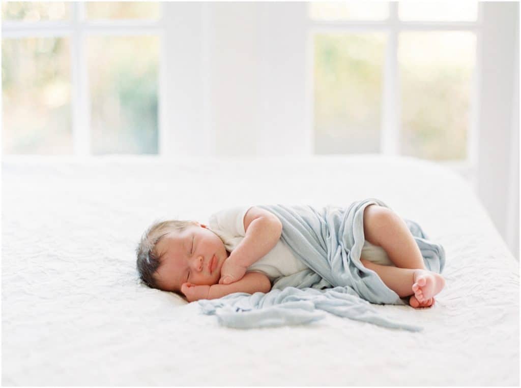 newborn baby boy portrait on white backdrop
